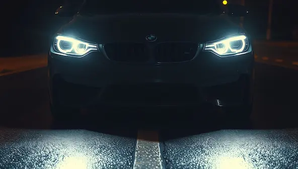 Car headlights shining evenly after learning to change a headlight bulb correctly.